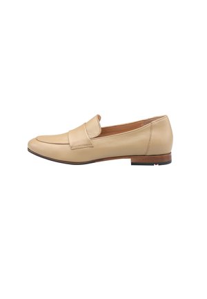 Beige leather loafer with a stitched toe, minimalist design, and a low wooden heel. Flat sole with a subtle black and red accent.