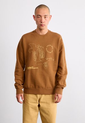 Sudadera marrón de corte relajado, con una ilustración bordada de patos y texto. Está hecha de un tejido suave con puños y dobladillo acanalados.