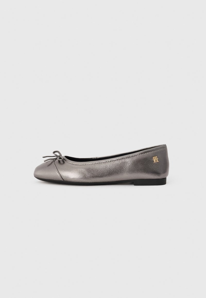 Metallic gray ballet flats with a rounded toe, bow accent, and small gold logo on the heel. Soft leather finish and flat rubber sole.