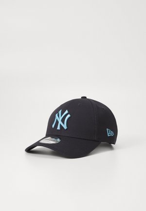 Navy blue baseball cap with light blue embroidered "NY" logo, curved brim, and adjustable back strap. Fabric is smooth and structured.
