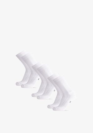 Chaussettes de sport blanches avec texture côtelée, hauteur cheville et orteil sans couture. Cinq paires affichées en rangée, avec un design minimal et peu de marques.