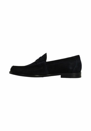 Navy suede loafer with stitched accent, rounded toe, and flat black sole. Features a decorative band across the front. Smooth texture.
