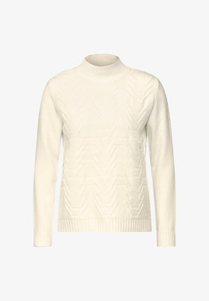 Suéter color crema con un alto cuello acanalado, que presenta un patrón de zigzag texturizado en el frente y puños y dobladillo acanalados.