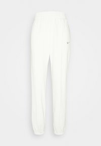 Bílé tepláky vyrobené z měkké látky, s elastickým pasem, z úženými nohavicemi a malým šedým logem Nike na levém bokě.