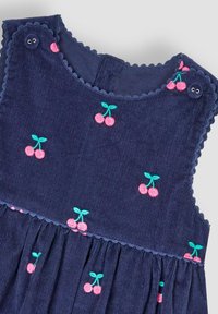 Navy corduroy jurk met geborduurde roze kersen en groene bladeren, scalloped halslijn en kunststof knoopsluitingen.