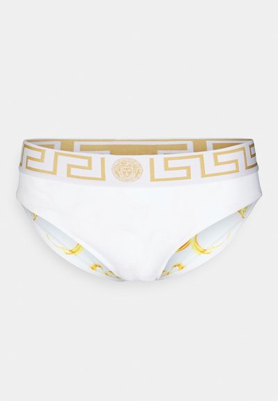 Bela plavalna spodnja obleka z zlatim grškim ključem na pasu in podrobnostjo logotipa. Notranja podloga ima subtilen rumen dizajn.