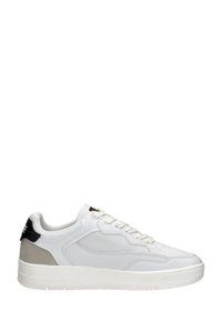 White sneakers with a smooth leather upper, textured mesh accents, gray suede heel, and white rubber sole, featuring black detail on the heel.