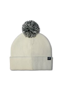 Cream-colored knit beanie with a black and white pom-pom on top. Features a ribbed cuff and a small brand tag on the side.