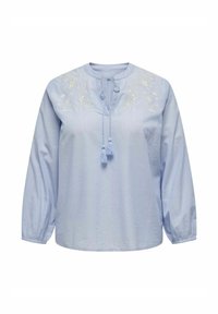 Világoskék, hosszú ujjú ing kerek nyakkivágással, hímzett virágmintával a mellrészen, és megkötős bojt részlettel a nyaknál.