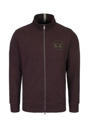 Heren zip-up jacker in dieppaars, gemaakt van zacht materiaal. Bevat een hoge kraag, twee voorzakken en een geborduurd logo op de borst.