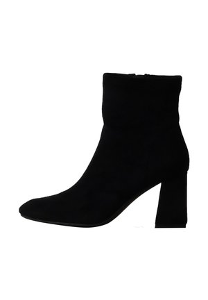 Bottine noire en daim avec talon bloc et bout pointu, conçue pour femmes.