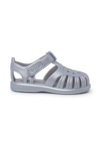 Gray plastic sandal with open design, adjustable strap, and ventilated sides. Features a flat sole and a closed toe. Brand logo visible.