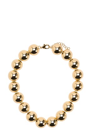 Bransoletka w kolorze złota z dużymi, polerowanymi okrągłymi koralikami połączonymi małymi ogniwami i zapięciem typu karabińczyk z regulowanym łańcuszkiem.