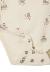 Cream-colored bodysuit featuring a print of bears in boats, blue accents, and silver snap fasteners at the bottom. Soft fabric texture.