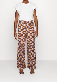 Résumé Spodnie materiałowe