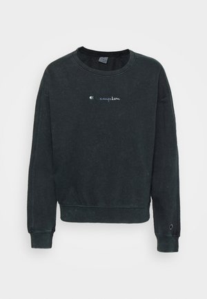 Felpa nera a girocollo realizzata in cotone. Presenta un piccolo logo "Champion" ricamato sul petto, con polsini e orlo a costine.