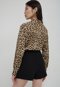 Calliope CON TORCIGLIONE - Gonna a portafoglio - nero