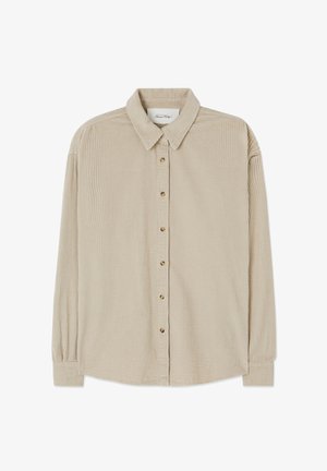 Béžová manšestrová košile s knoflíkovým zapínáním vpředu, klasickým límečkem, dlouhými rukávy a jemnou vertikální žebrovanou teksturou. Má zlatě tónované knoflíky.
