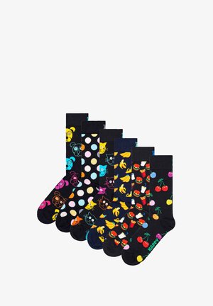 Set of seven black socks featuring colorful patterns: animals, polka dots, bananas, food items, and cherries with "HAPPY" text in green.