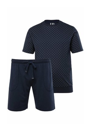 Two-piece loungewear set in navy blue. Short-sleeve shirt features white polka dots; shorts have an elastic waistband and pockets.