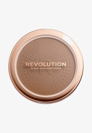 Rund bronzer kompakt med en glitrende rosa-guld kant, med en prikket tekstur på overfladen og "Revolution" prægede i guld bogstaver.