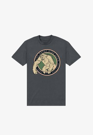 Mørkegrå t-shirt med en brølende King Kong-grafik inden for en cirkulær emblem med teksten "The Great King Kong Legend of Skull Island."