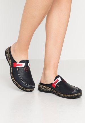 Black leather clogs with red and white accents, featuring a textured rubber sole and decorative stitching. Open back design, rounded toe.