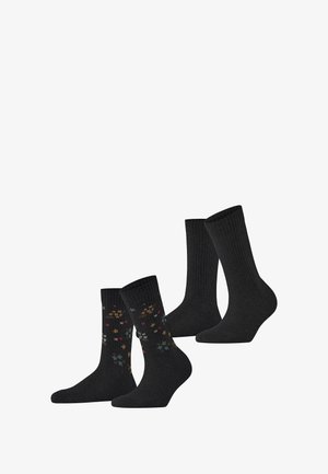 Zwei Paar schwarze Socken; ein Paar hat ein farbenfrohes Blumenmuster, das andere ein einfarbiges Rippdesign. Beide bestehen aus einer weichen Baumwollmischung.