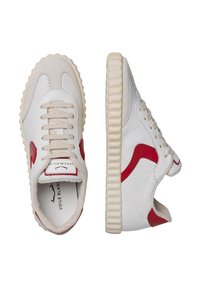White sneakers with red accents, made of leather and suede. Features perforated texture, round laces, and a textured rubber sole.
