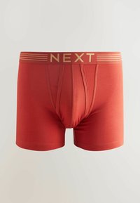 Piros boxer alsónadrág, rugalmasságot biztosító anyagból, arany "NEXT" logóval a derékrészen, vízszintesen csíkozott dizájnnal. Feszes fazon, sima felület.
