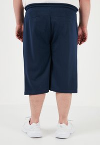 Buratti PLUS SIZE - Verryttelyhousut - indigo