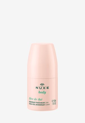 Déodorant NUXE en flacon plastique effilé rose, avec un logo et un texte verts. Capacité de 50 ml, conçu pour une sensation de fraîcheur.