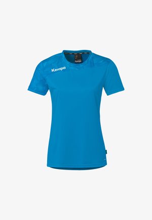 T-shirt de sport bleu pour femme à manches courtes avec motif géométrique sur le haut de la poitrine et l'épaule, logo Kempa sur le côté gauche de la poitrine et à l'intérieur du col.