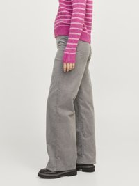 Wide-leg gray corduroy pants with a soft texture, featuring side pockets and a relaxed fit, paired with black chunky-sole shoes.
