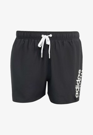 Černé plavky vyrobené z lehkého materiálu, s bílou šňůrkou na stažení a nápisem "adidas" vytištěným bílou barvou na boku.