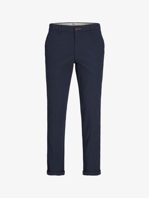 Navy blue chinos made of lightweight cotton. Features a button closure, side pockets, and rolled cuffs at the ankles. Classic fit design.