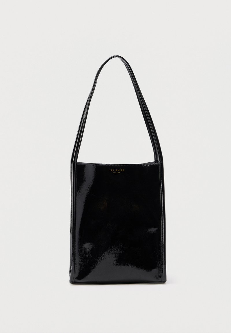 Sac cabas en cuir verni noir avec une forme rectangulaire, des bretelles fines pour l'épaule et un logo doré à l'avant. Texture lisse et brillante.