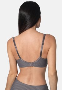 Grey bra with thin straps, featuring a pinstripe pattern. Smooth texture with a hook closure at the back. Minimalist design.