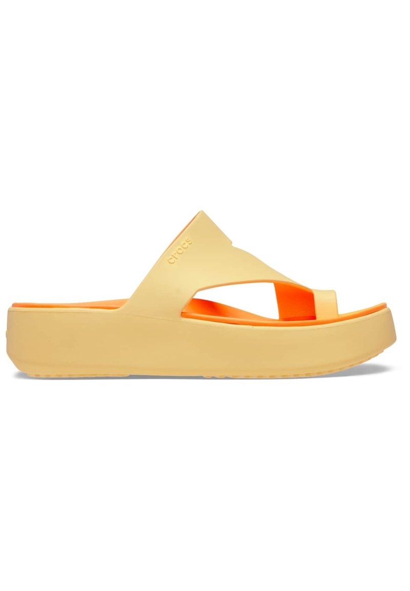 Yellow platform slide sandals with orange accents; made of soft material featuring crossover straps and a textured sole for grip.