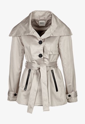 Beige trench coat with a wide collar, black buttons, a belted waist, and zipper pockets. Smooth texture and cinched silhouette.
