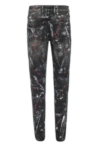 Schwarze Denim-Jeans mit einem Sprühfarbenmuster in Rot und Weiß, Slim Fit, fünf Taschen und einem markierten Bund auf der Rückseite.