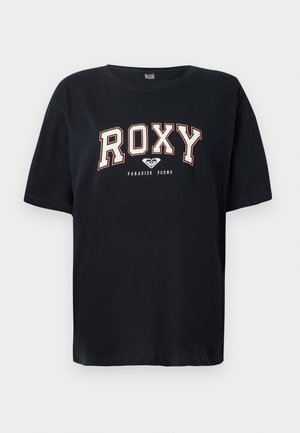 T-shirt noir en coton à manches courtes. Présente un texte "ROXY" en blanc et rouge et "PARADISE FOUND" en dessous. Coupe régulière et col rond simple.