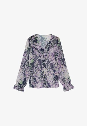 Blouse longue à manches longues transparente avec imprimé floral violet et blanc, poignets volantés et col en V à volants sur un fond sombre.
