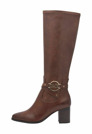 Brown knee-high boot made of synthetic leather with a pointed toe, gold logo accent, and a stacked heel. Features a strap detail.