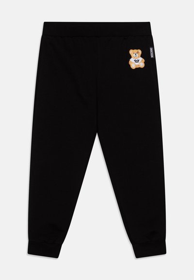 Schwarze Baumwoll-Sweatpants mit elastischem Bund und Bündchen; mit einem gestickten Teddy-Bären-Patch am linken Oberschenkel.