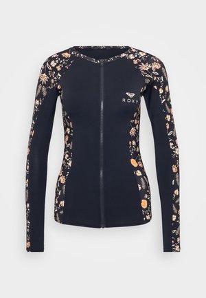 Navy long-sleeve rash guard with a floral pattern. Features a front zipper and Roxy logo at the chest. Made of stretchy, lightweight material.
