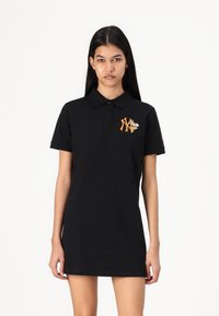 Black polo dress made of cotton with a collar, featuring an orange NY logo and floral embroidery on the chest. Short sleeves.