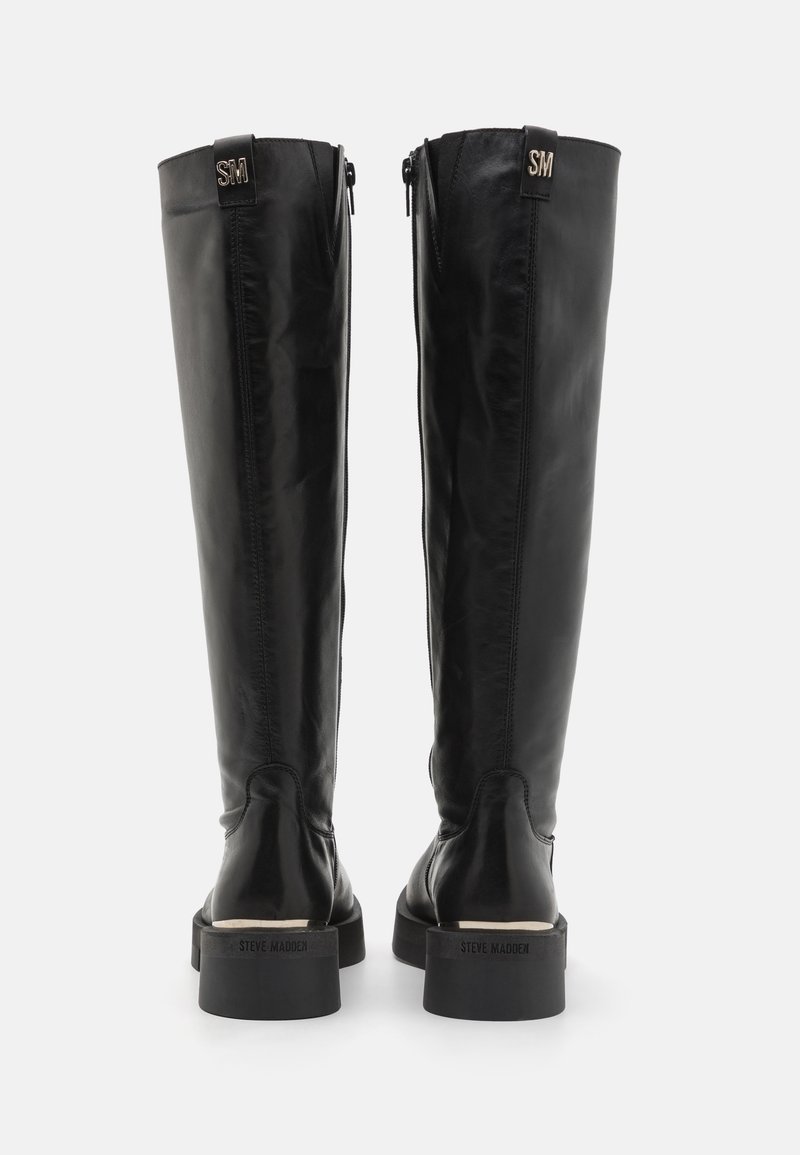Knöchelhohe schwarze Lederstiefel mit einem eleganten Design, seitlichen Reißverschlüssen und einer strukturierten Oberfläche sowie einem mattschwarzen Blockabsatz.