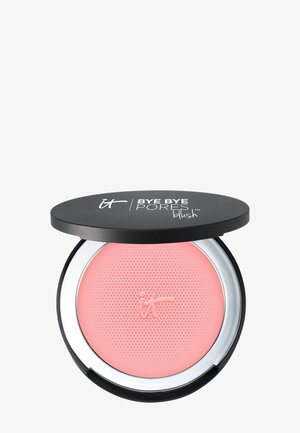 Étui à maquillage noir compact avec couvercle partiellement ouvert montrant un blush rose texturé à l'intérieur, étiqueté "Bye Bye Pores" et marque "it".
