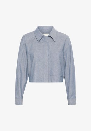 Gekürztes blaues Chambray-Hemd mit Kragen, langen Ärmeln, einer Brusttasche und subtiler Textur. Entworfen für eine lockere Passform.